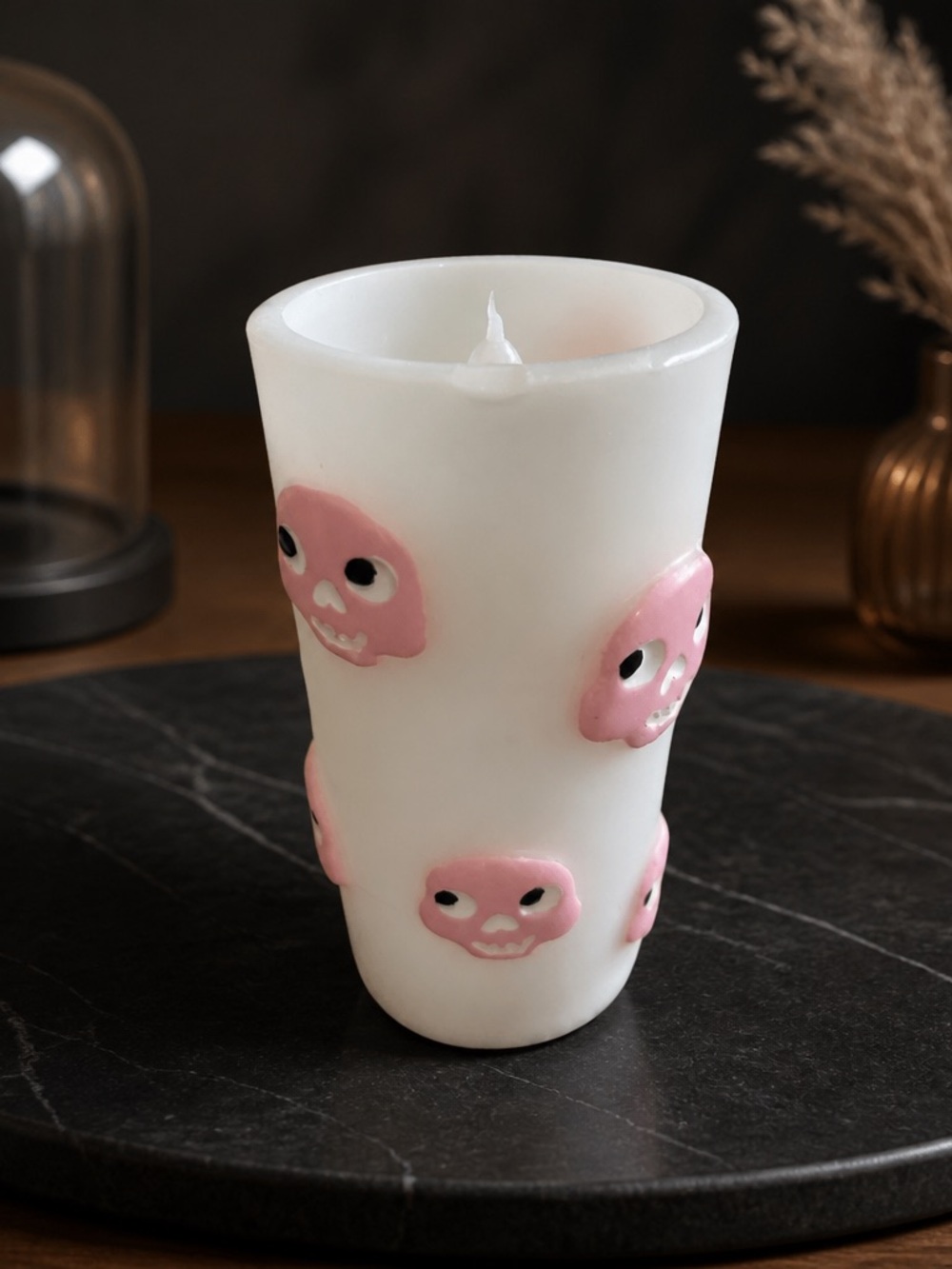 White Candle with Pink Skull Accents -